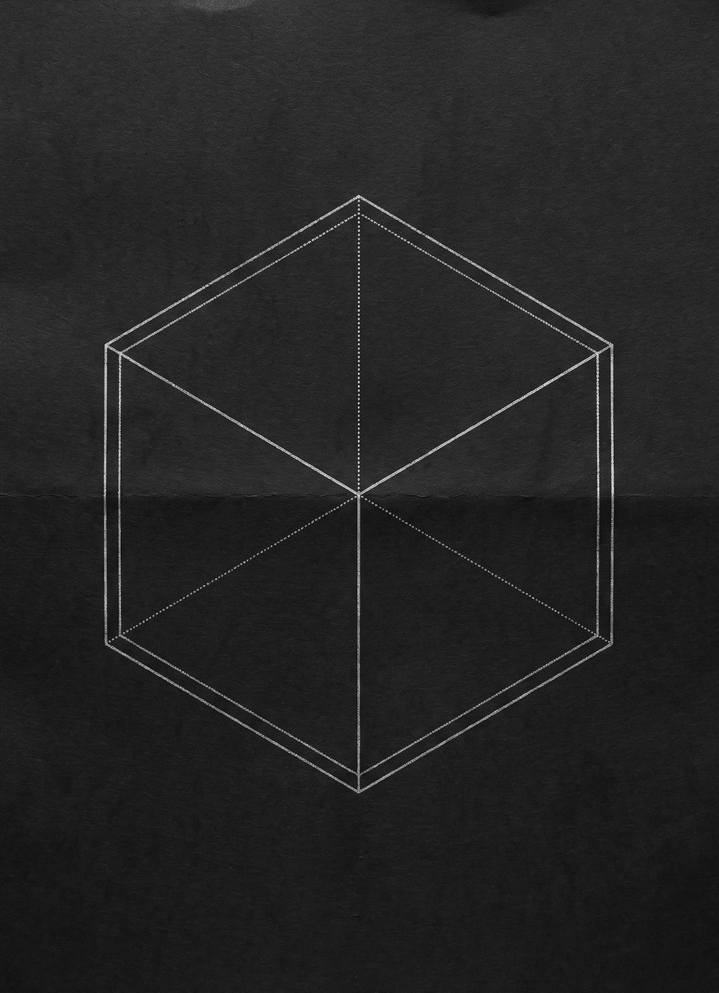 Line drawing of a cube on black paper