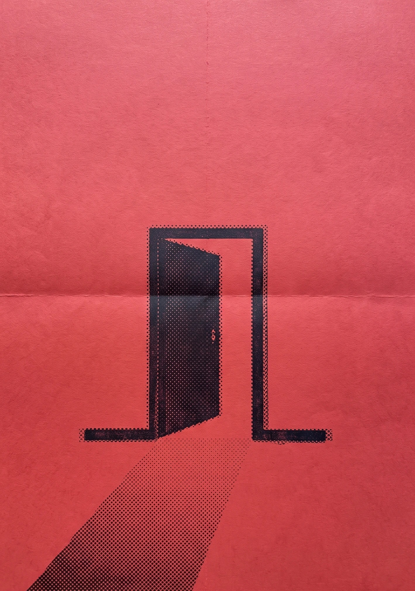 An open door with light falling through it, on red paper